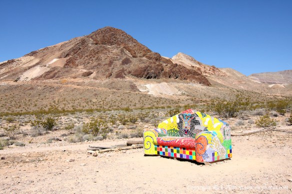 Brightly Colored Sofa and Sutherland Mountain in Rhyolite, Nevada. Photographed 03/08